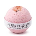 Cherry blossom bath bomb with Himalayan salt in soft bath setting