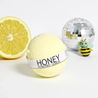 Lemon bath bomb with honeybee and citrus accents